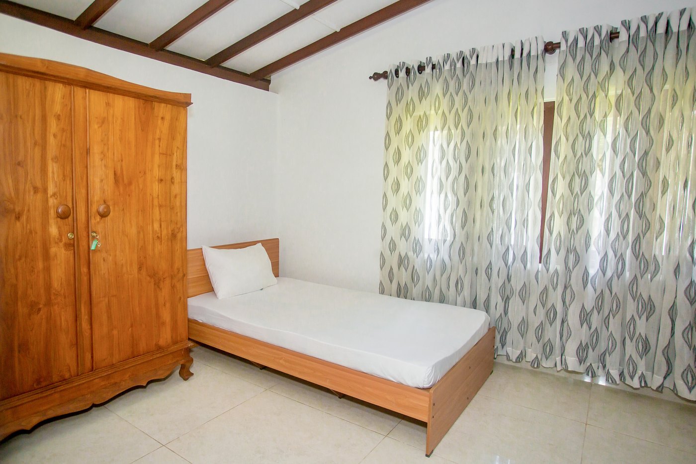Single room with a teak wardrobe