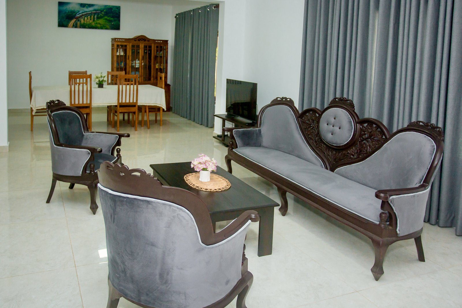 Open living room with carved sofas